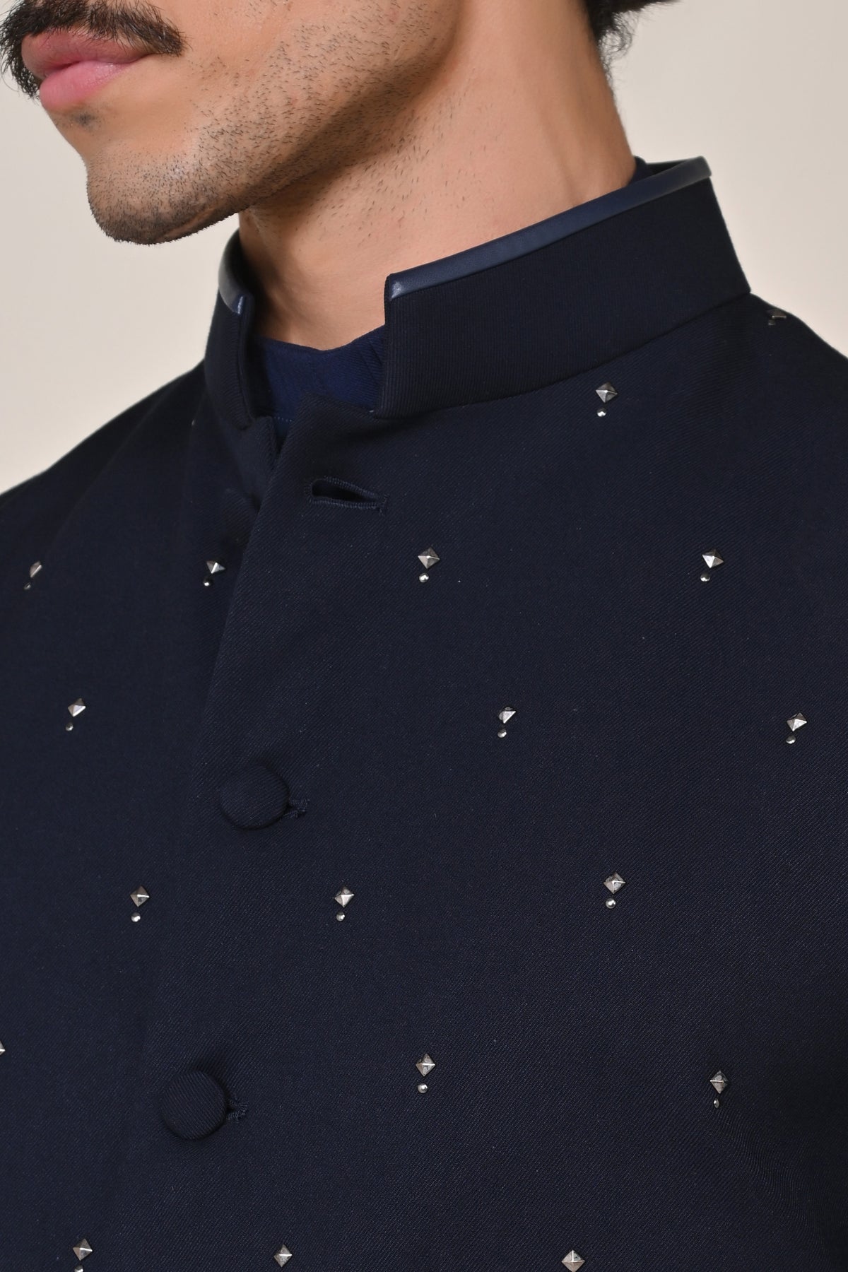 Color-Blocked Waistcoat with Rivet Accents.